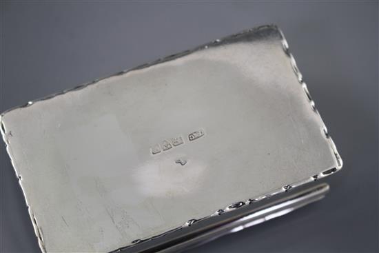 An Edwardian silver and enamelled cabochon set rectangular box and hinged cover, the enamel decorated with the bust of a lady